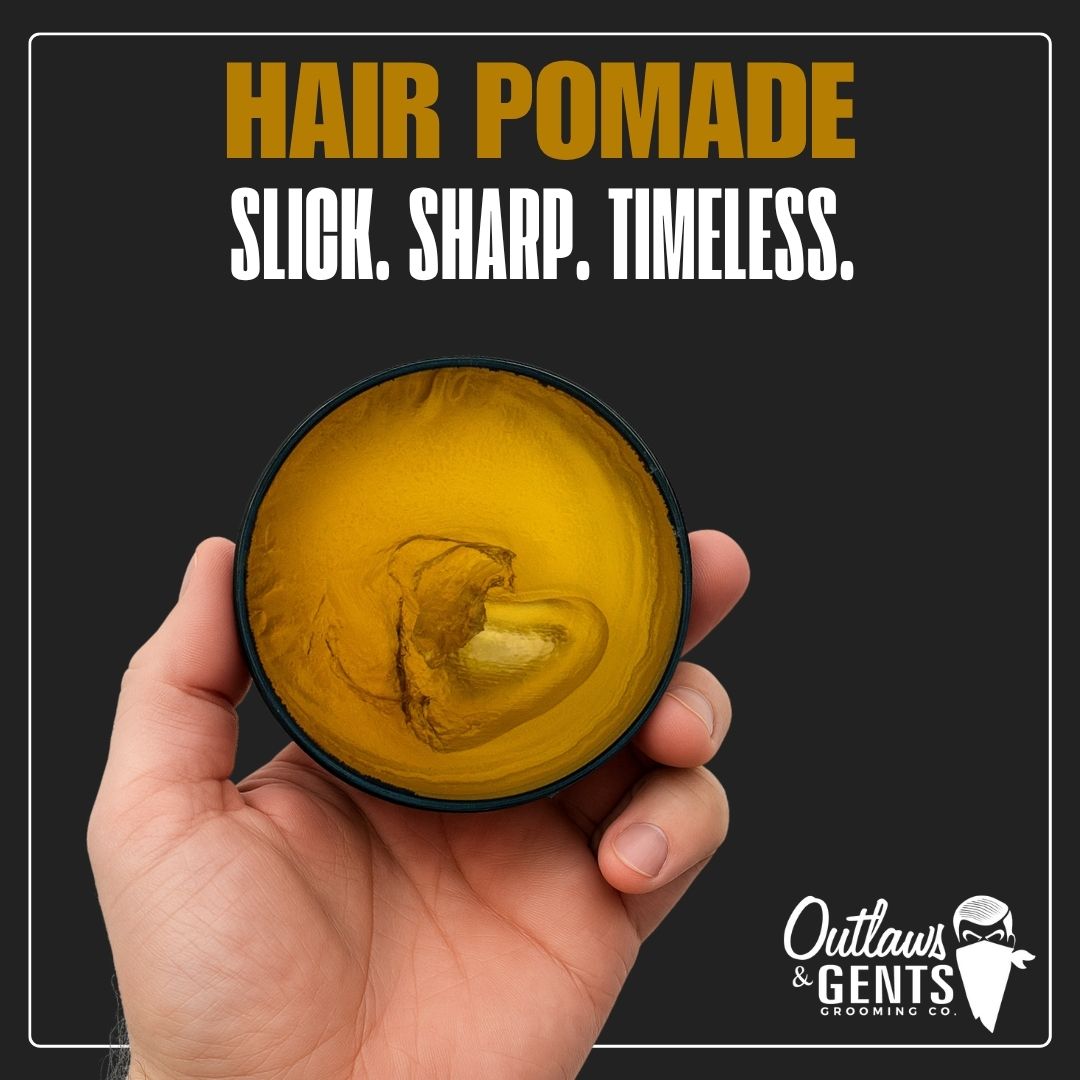 Hand holding an open puck of Outlaws and Gents Hair Pomade