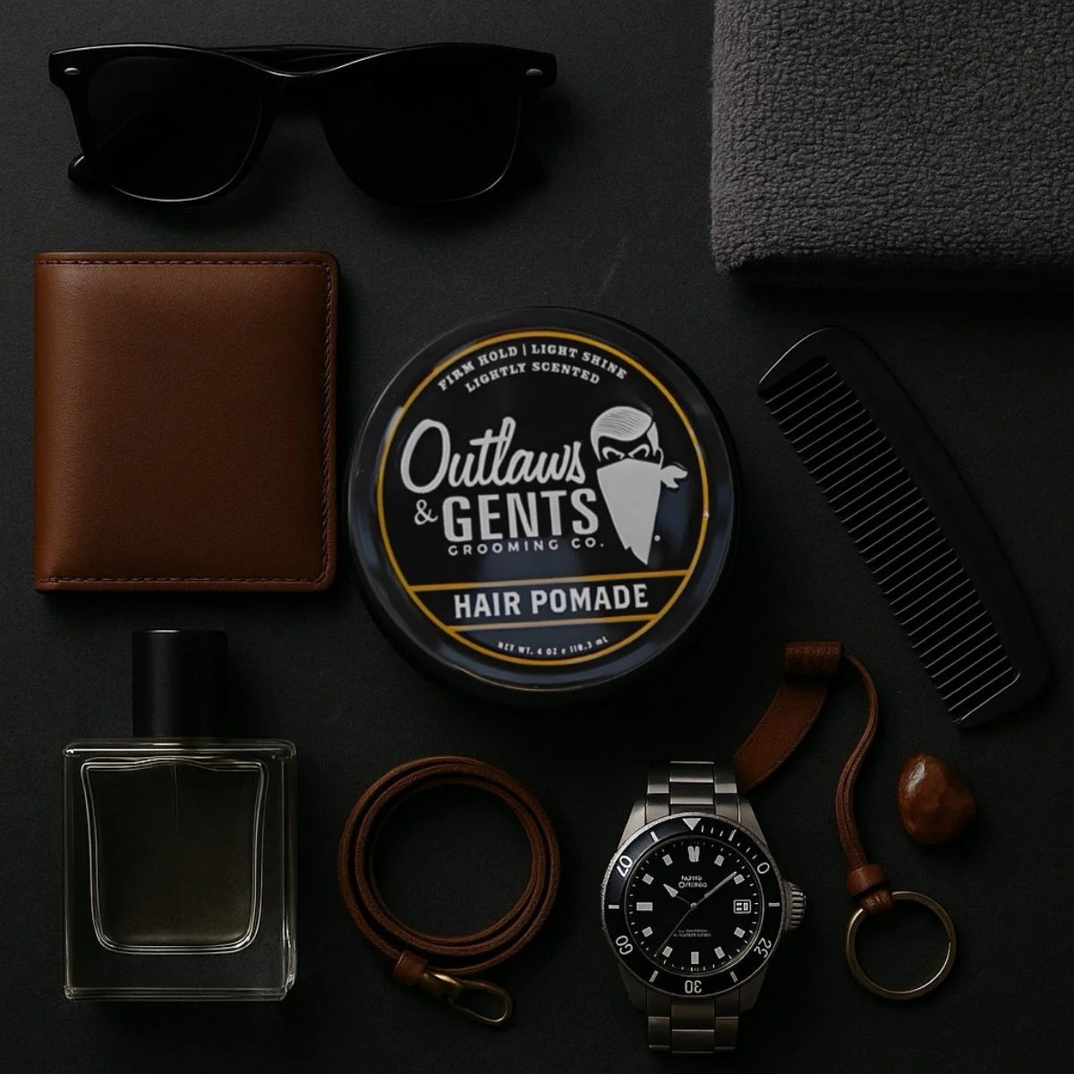 Outlaws and Gents hair pomade with watch, wallet and other male accessories